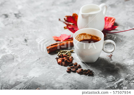 Cup of espresso with milk and spices 57507934
