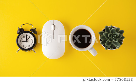 Mouse, clock and coffee cup on yellow background 57508138