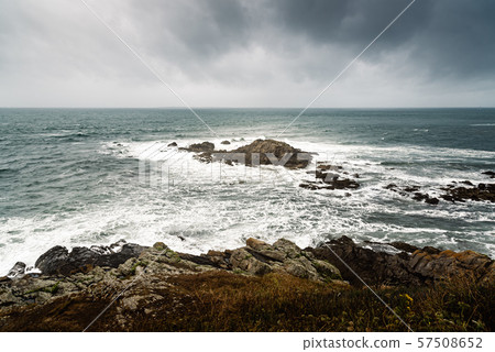 Scenic view of cliffs and sea against sky 57508652