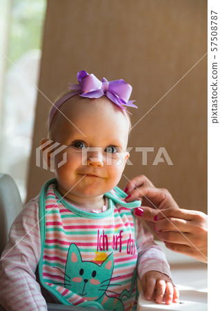 Baby girl looking and smiling Baby girl looking and smiling 57508787