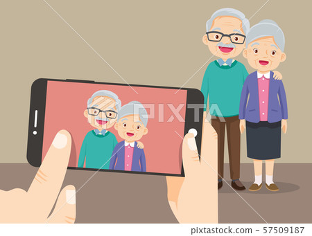 hand hold smartphone with the grandparents take 57509187