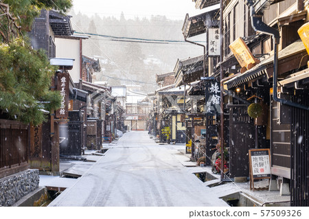 Takayama old town with snow falling in Gifu, Japan 57509326