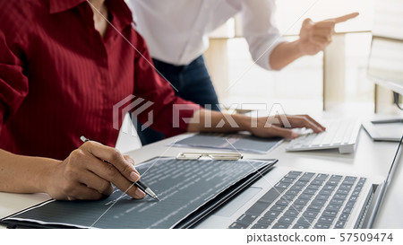 Programmer working in a software development and Programmer working in a software development and 57509474
