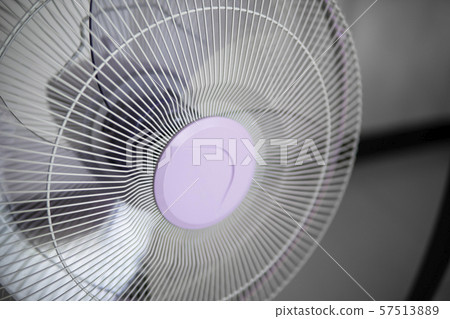 Modern violet electric fan in a living room saving peoples from hot temperature in summer days. Modern violet electric fan in a living room saving peoples from hot temperature in summer days. 57513889