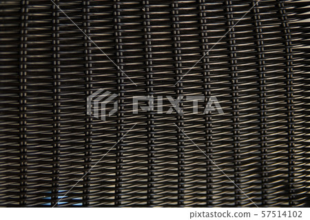 Brown rattan pattern texture on a chair. Brown rattan pattern texture on a chair. 57514102