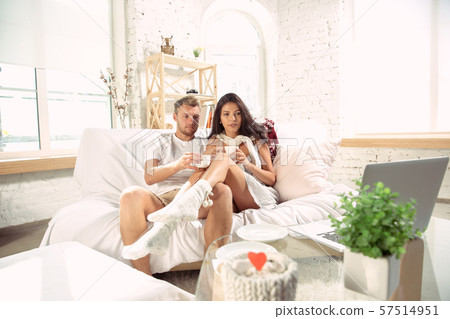 Couple of lovers at home relaxing together, comfortable 57514951