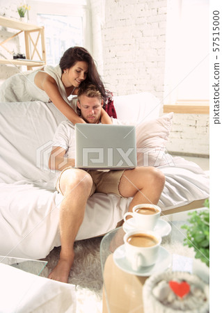 Couple of lovers at home relaxing together, comfortable 57515000