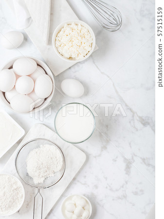 Fresh dairy products on white marble background. 57515159