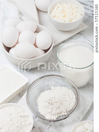 Fresh dairy products on white marble background. Fresh dairy products on white marble background. 57515160
