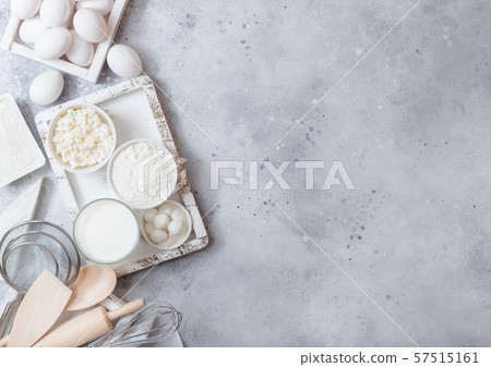 Fresh dairy products on white table background. Fresh dairy products on white table background. 57515161