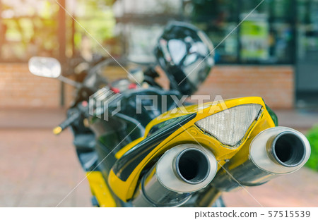 A sporty motorcycle parked in front of a coffee A sporty motorcycle parked in front of a coffee 57515539