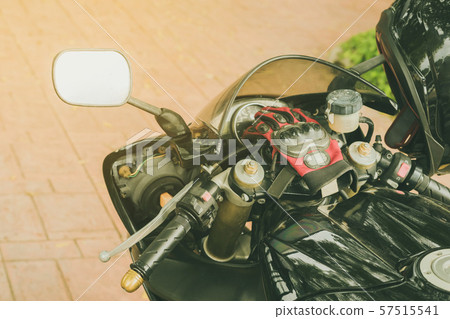 A sporty motorcycle parked in front of a coffee 57515541