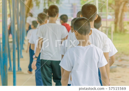 Group of students try to meditate for the peace of mind by walk with Buddhist monk in school. Group of students try to meditate for the peace of mind by walk with Buddhist monk in school. 57515569