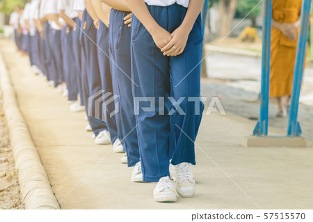 Group of students try to meditate for the peace of mind by walk with Buddhist monk in school. Group of students try to meditate for the peace of mind by walk with Buddhist monk in school. 57515570