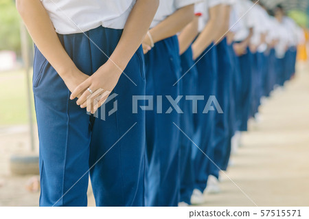 Group of students try to meditate for the peace of mind by walk with Buddhist monk in school. Group of students try to meditate for the peace of mind by walk with Buddhist monk in school. 57515571