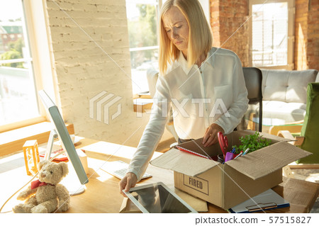 Young businesswoman fired, looks upset Young businesswoman fired, looks upset 57515827