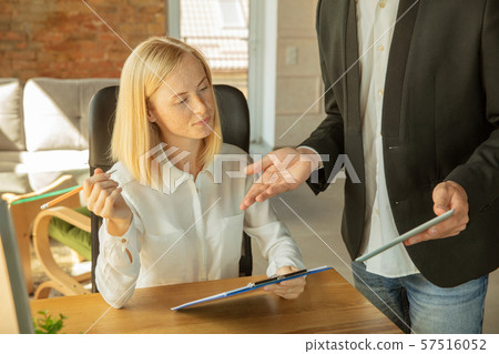 A young businesswoman moving in office, getting new work place A young businesswoman moving in office, getting new work place 57516052