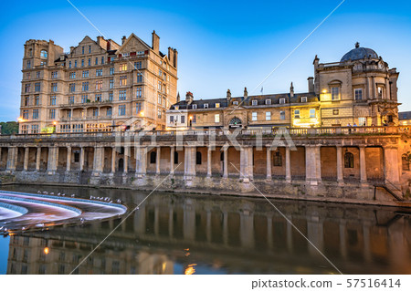 Evening view of historic riverside buildings 57516414