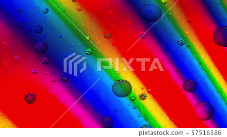Water drops cover rainbow LCD screen, macro shot 57516586