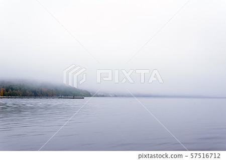 mountain lake hidden by fog mountain lake hidden by fog 57516712