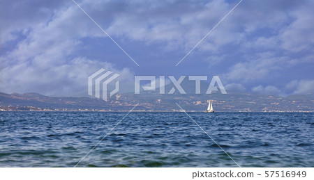 The silhouette of a sailing yacht on the horizon 57516949