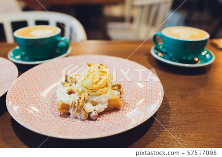 Whole wheat waffles with ice cream, maple syrup and coffee. Wooden background. Close up. 57517098
