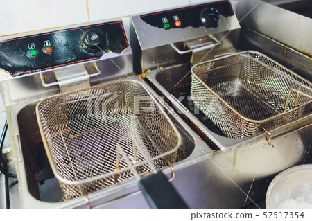 Used dirty iron pan with oil and dirty turner and space for write wording, bad cooking behavior 57517354