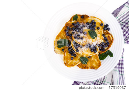 Tasty sweet pancakes with sugar and blueberries Tasty sweet pancakes with sugar and blueberries 57519087