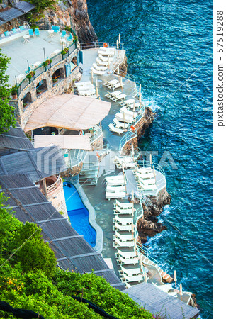 Beautiful cozy bay with boats and clear turquoise water in Italy Beautiful cozy bay with boats and clear turquoise water in Italy 57519288