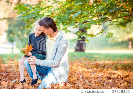 Family of dad and kid on beautiful autumn day in the park 57519293
