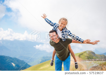Beautiful happy family in mountains in the background of fog 57519637