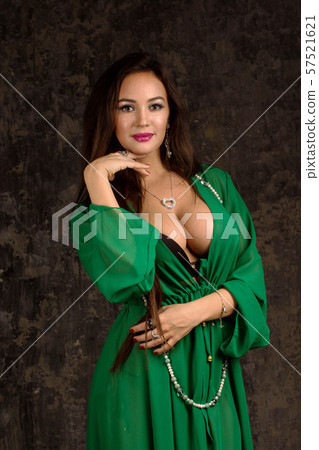 Beautiful woman in green abaya. Beautiful woman in green abaya. 57521621