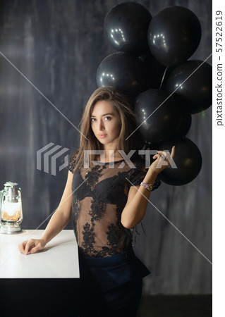 Sexy young brunette posing near a table Sexy young brunette posing near a table 57522619