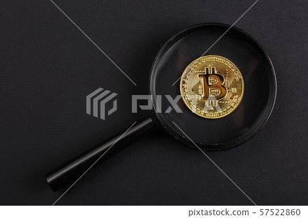 coin bitcoin under a magnifying glass coin bitcoin under a magnifying glass 57522860
