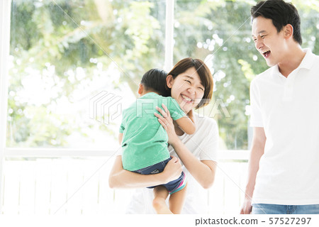 A mother hugging a boy 57527297