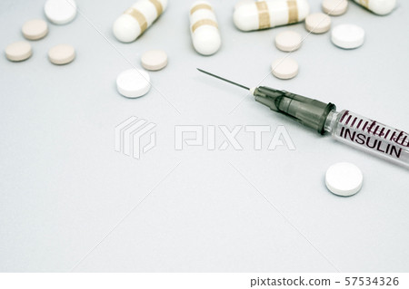 Insulin syringe, injection needle and some tablets Insulin syringe, injection needle and some tablets 57534326