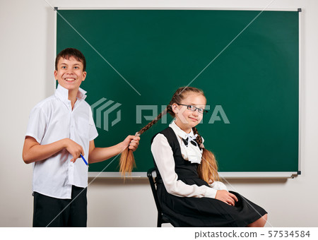 Portrait of a schoolboy and schoolgirl playing Portrait of a schoolboy and schoolgirl playing 57534584
