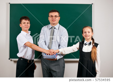 Portrait of a teacher and pupil, posing at 57534595
