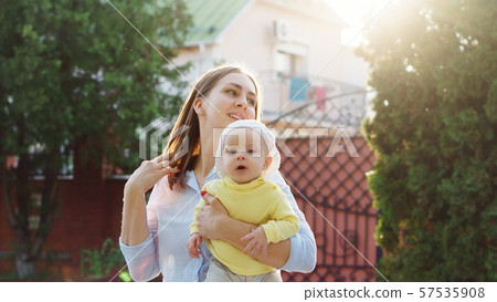 Mom and baby for a walk Mom and baby for a walk 57535908