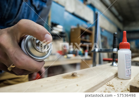 Furniture fittings and wooden dowels. Carpenter spray on dowel Furniture fittings and wooden dowels. Carpenter spray on dowel 57536498