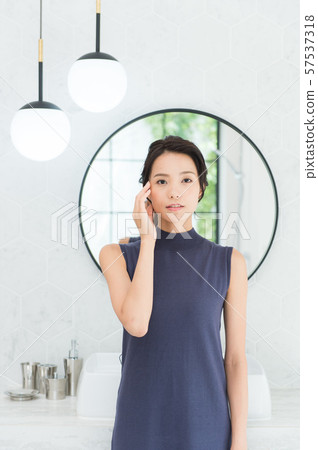 Young woman in bathroom Young woman in bathroom 57537318