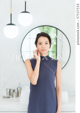 Young woman in bathroom Young woman in bathroom 57537319