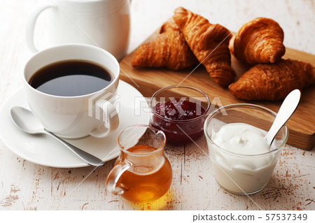 Breakfast (coffee, croissant, yogurt) Breakfast (coffee, croissant, yogurt) 57537349