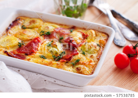 Casserole with sweet potatoes, brussel sprouts, bacon 57538785