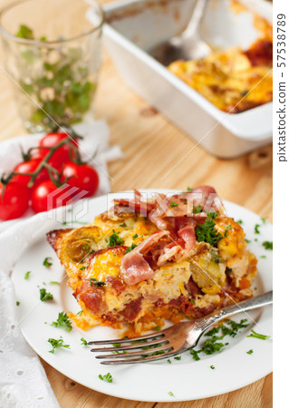Casserole with sweet potatoes, brussel sprouts, bacon 57538789