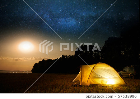 Traveling and camping concept - camp tent at night Traveling and camping concept - camp tent at night 57538996