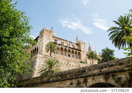 Almudaina Palace under the blue sky and strong sunlight in Mallorca, Spain Almudaina Palace under the blue sky and strong sunlight in Mallorca, Spain 57539024