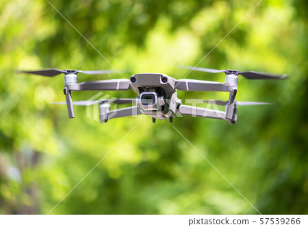 Flying drone with camera hovering Flying drone with camera hovering 57539266