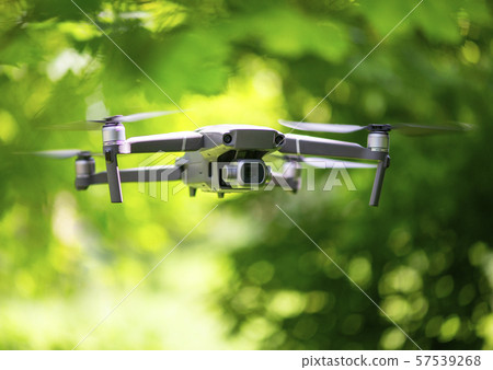 Flying drone with camera hovering Flying drone with camera hovering 57539268