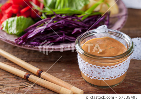 Vegetable salad with asian peanut coconut dressing Vegetable salad with asian peanut coconut dressing 57539493